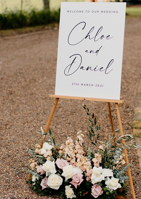 wedding welcome sign and flowers styling