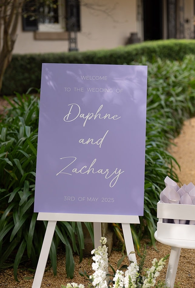 lilac and white wedding welcome sign